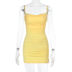 Detailed view of yellow ruched mini dress showing elastic fabric and side pleats