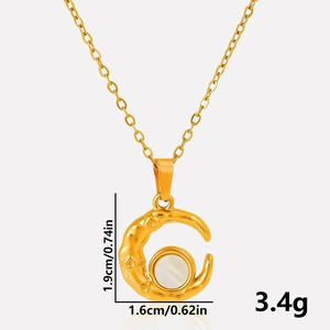 Detail view of gold moon pendant with white shell inlay showing dimensions 1.9cm by 1.6cm