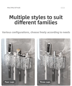 Detail of wall-mounted metal toothbrush holder with three and four glass cups
