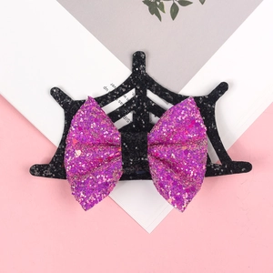 Detail of Halloween hair clip with spider web base and purple glitter bow for girls