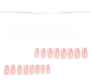 Macro shot of 24pcs long coffin press-on nails with white French tips and nude glossy finish