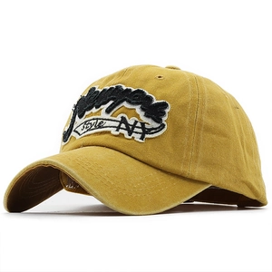 Detail of mustard yellow washed cotton baseball cap with 3D NY embroidery and retro style