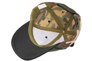 Detail of the camouflage baseball cap interior with 100% polyester label and stitching