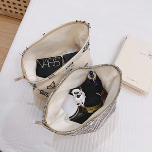 Minimalist canvas and tweed cosmetic bags with butterfly embroidery and metal zippers