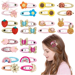 Detail showing various sequin cartoon animal and fruit snap hair clips for girls