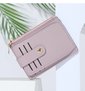 Lavender PU leather card holder with gold zipper and button detail against a minimal background