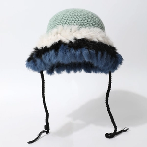 Winter knitted faux fur bucket hat in colorful mint green and blue patchwork design