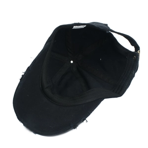 Distressed black cotton baseball cap with torn details and adjustable metal buckle