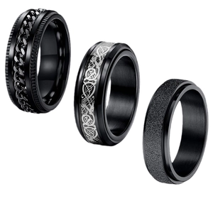 Three black titanium steel rings featuring rotating chain, celtic dragon, and matte finish