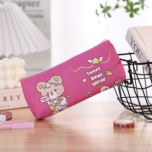 Close-up of pink canvas pencil case with cute bear prints on a desk organizer