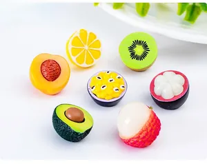 Macro view of detailed miniature resin fruits including avocado, lychee and peach