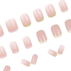 French tip press-on nails in soft nude pink with yellow accents on a white background
