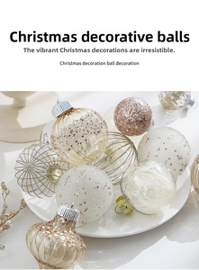 Close-up of 8cm Christmas balls in champagne gold and glitter on a white plate