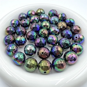 Rainbow plated acrylic faceted beads displayed on a white ceramic plate for DIY jewelry