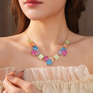 Colorful geometric square pendant necklace set with vibrant enamel blocks on gold chain