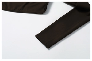 Detail of high-density knit fabric and double-needle stitching on dark coffee yoga top