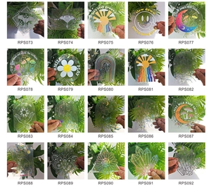Detailed grid of 20 rainbow prism suncatcher window decals with boho nature patterns
