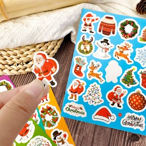 Macro detail of waterproof Christmas stickers with Santa, reindeer and snowman designs