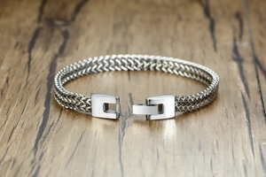 Detail view of silver stainless steel dragon bone chain bracelet with square buckle closure