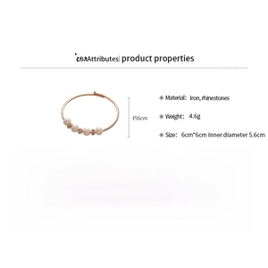 Detailed view of layered pearl and rhinestone cuff bracelet with 6cm size specifications