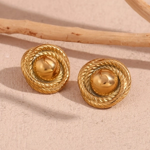 Macro view of 18K gold plated vintage button earrings with twisted rope texture