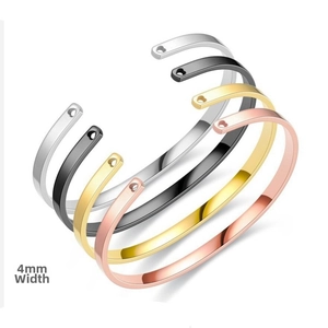 Detail of 4mm stainless steel C-shape bangles in gold, silver, rose gold and black