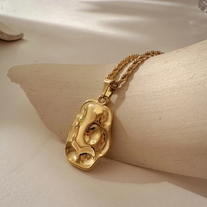 18K gold plated stainless steel necklace with irregular hammer textured lava pendant