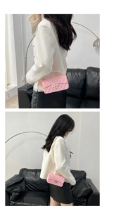 Pink silicone jelly bag featuring classic quilted pattern and elegant pearl handle detail