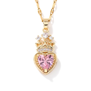 Elegant gold necklace featuring a pink heart-shaped zircon and a sparkling crown pendant