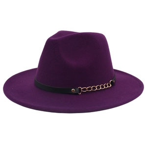 Detail of purple wide brim fedora with black leather band and gold chain accent
