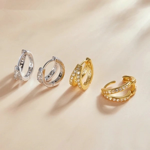 Elegant geometric hoop earrings with cubic zirconia in silver and gold plated finishes
