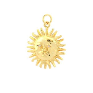 Detailed close-up of a gold-plated sun face pendant featuring sparkling zircon eyes