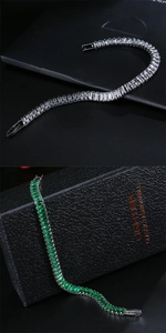 Detail of silver and emerald green rectangle-cut zircon tennis bracelets with secure clasps
