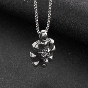 Detailed view of silver stainless steel tiger head pendant in 3D geometric shield design