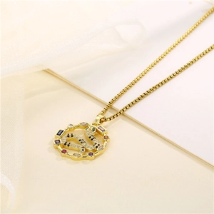 Gold snake pendant necklace with multicolored cubic zirconia on thin chain with white veil