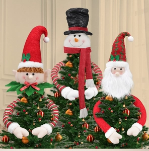 Detailed trio of plush Christmas tree toppers featuring elf, snowman and Santa Claus