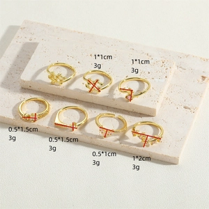 Set of gold leaf rings with pink zircon, featuring minimalist retro French style designs