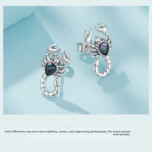 Detailed close-up of S925 sterling silver scorpion earring with pear-cut gradient gemstone