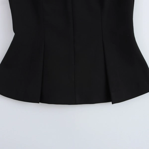 Close-up of the pleated hem and tailored stitching on this black sleeveless vest top