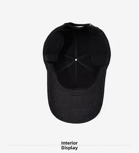 Interior view of warm black wool winter baseball cap with foldable ear flaps