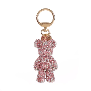 Detailed close-up of pink diamond-studded bear keychain with rose gold lobster clasp