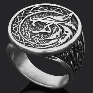 Macro shot of Viking Thor's Hammer ring with wolf head relief and vintage silver finish