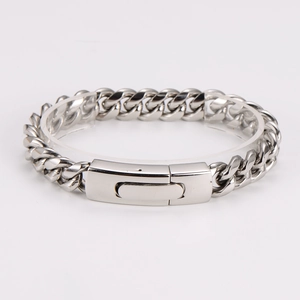 Detailed close-up of polished stainless steel Cuban link bracelet with a flat metal buckle