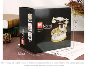 Detail view of Noble retro telephone music box packaging with 18.5x13x17.5cm dimensions