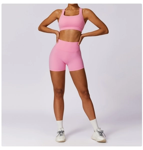 Pink high-waist fitness set with racerback sports bra and peach-lift yoga shorts