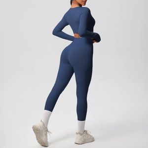 Rear view of navy blue high-waist leggings and long-sleeve crop top yoga set
