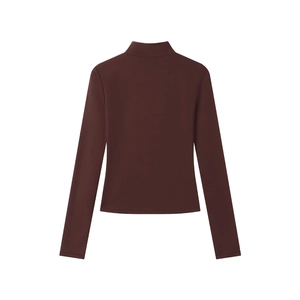 Close-up of brown slim fit long sleeve top with mock neck and textured stretch fabric