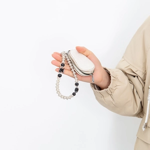 White crocodile texture mini wallet with silver zipper and beaded hand strap for keys
