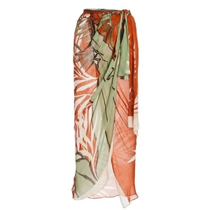 Detailed view of tropical palm leaf print sarong with orange and green texture
