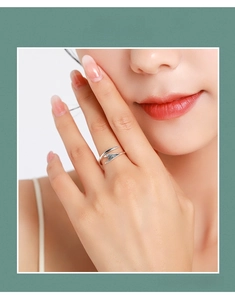 Detail of s925 silver adjustable open ring with abstract streamlined floral design